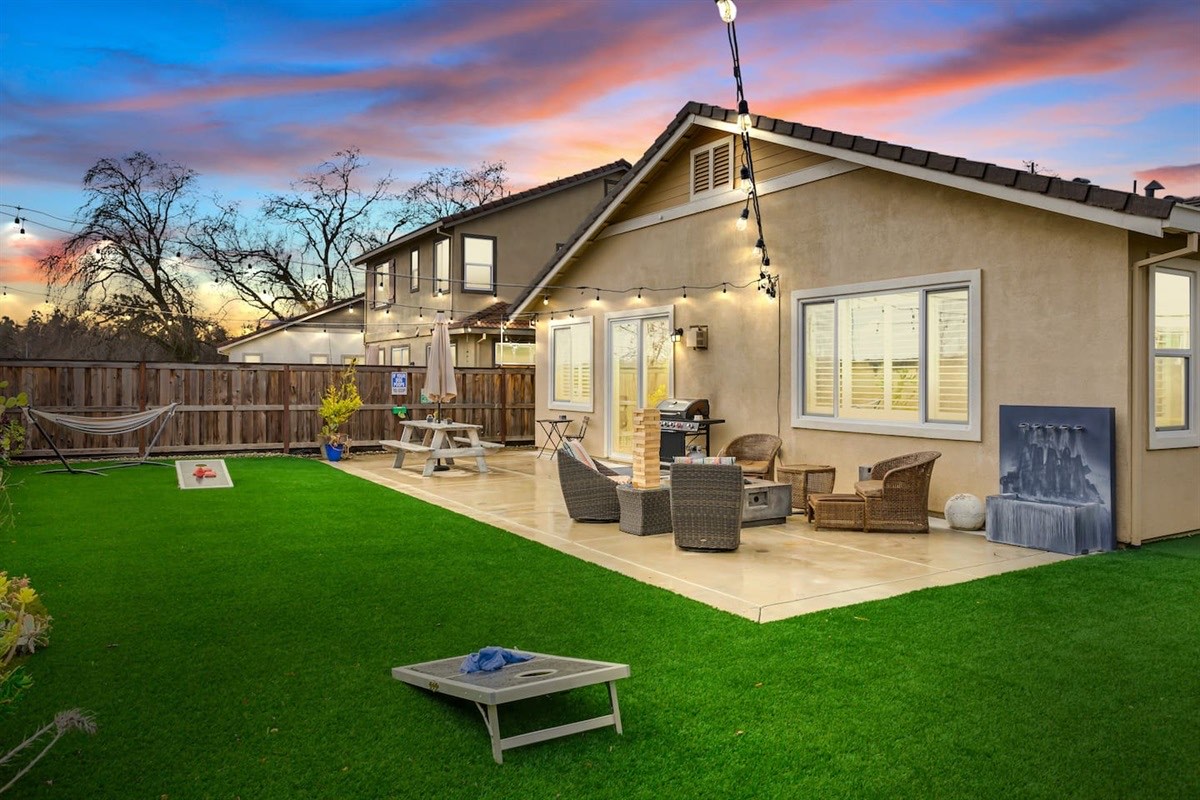 Your pets, kids, friends and family will fall in love with this back yard! Fully fenced, fake turf, market lights, BBQ and Gas fire pit